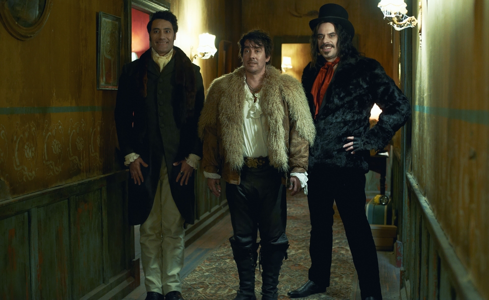 Taika Waititi, Jonathan Brugh, and Jemaine Clement in a scene from "What We Do in the Shadows"