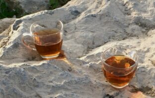 two shot glasses containing drinks