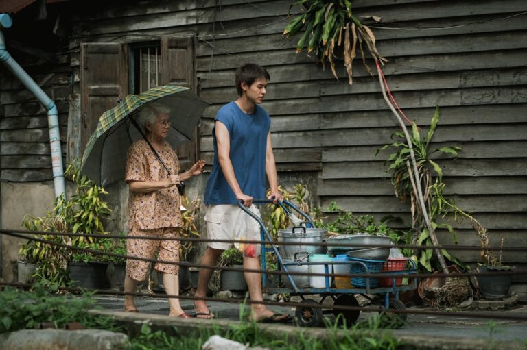 Usha Seamkhum and Putthipong Assaratanakul in a scene from "How to Make Millions Before Grandma Dies"