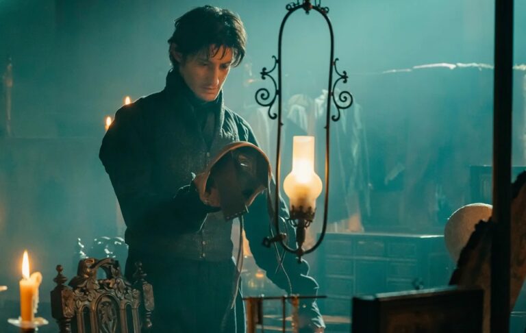 Edmond Dantès (Pierre Niney) taking off one of his several masks, in a scene from "The Count of Monte Cristo"