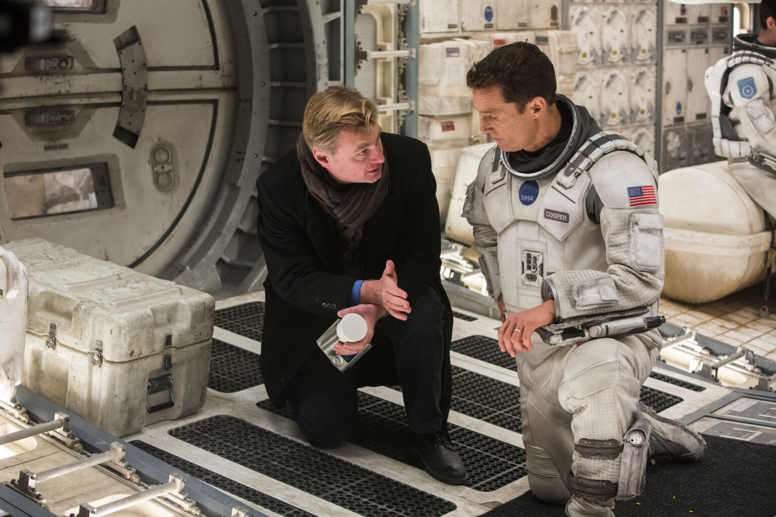 Director/Co-Writer/Producer Christopher Nolan discusses a scene with Matthew McConaughey on the set of "Interstellar"