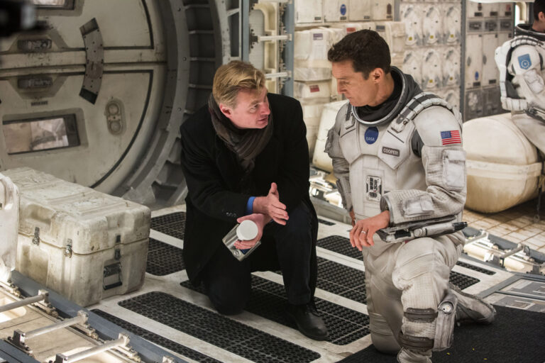 Director/Co-Writer/Producer Christopher Nolan discusses a scene with Matthew McConaughey on the set of "Interstellar"